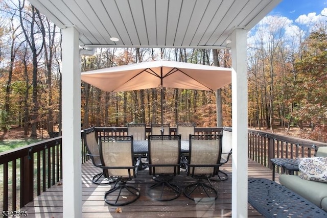 wooden deck with outdoor dining area