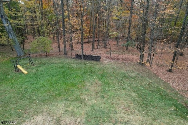 view of yard with a wooded view