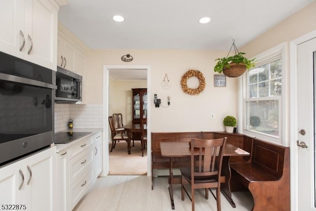 dining room featuring recessed lighting