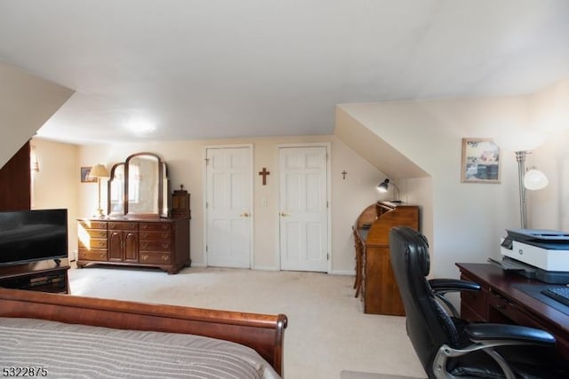 carpeted bedroom featuring baseboards