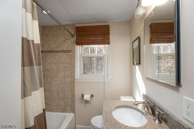 bathroom featuring vanity, toilet, and shower / tub combo with curtain