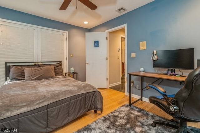 bedroom with light wood-type flooring and ceiling fan