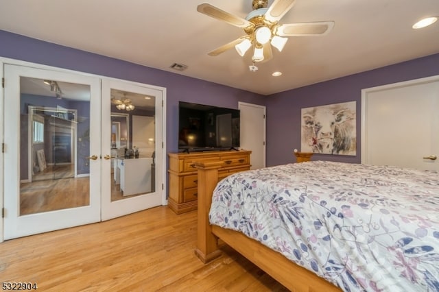 bedroom featuring french doors, light hardwood / wood-style flooring, and ceiling fan