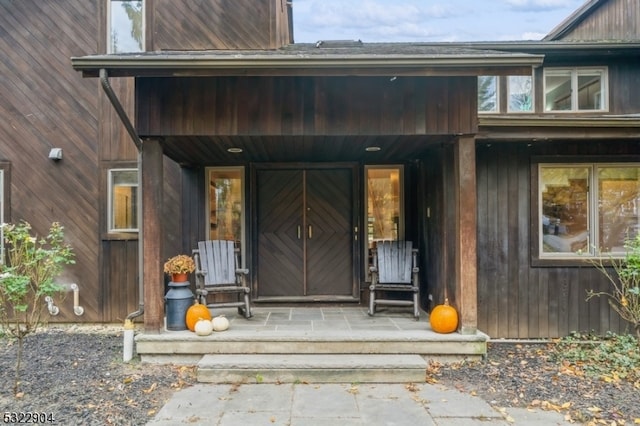 property entrance featuring covered porch