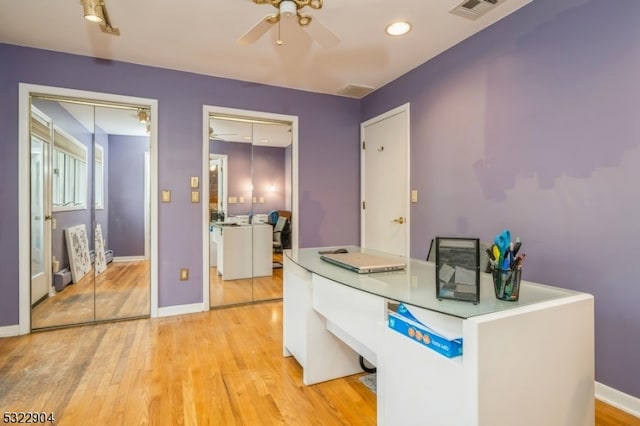 office featuring ceiling fan and light hardwood / wood-style flooring