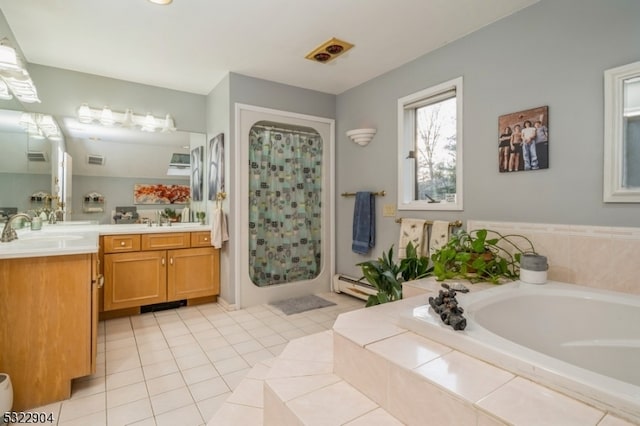 bathroom featuring a baseboard heating unit, vanity, tile patterned flooring, and separate shower and tub