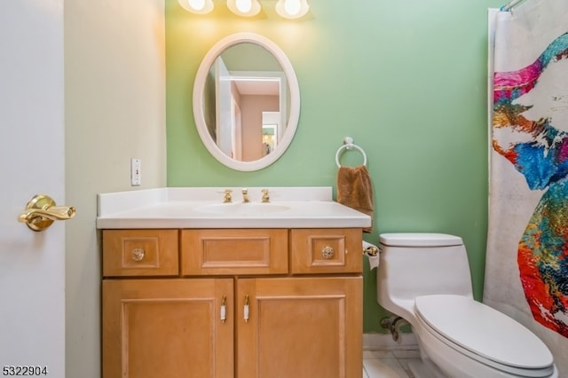 bathroom featuring toilet and vanity