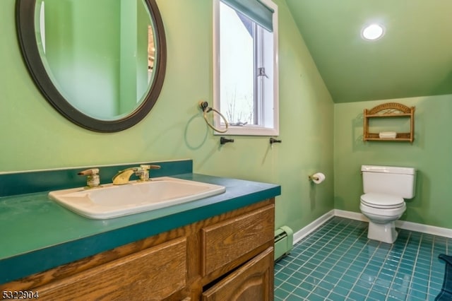 bathroom featuring tile patterned floors, vanity, toilet, lofted ceiling, and baseboard heating