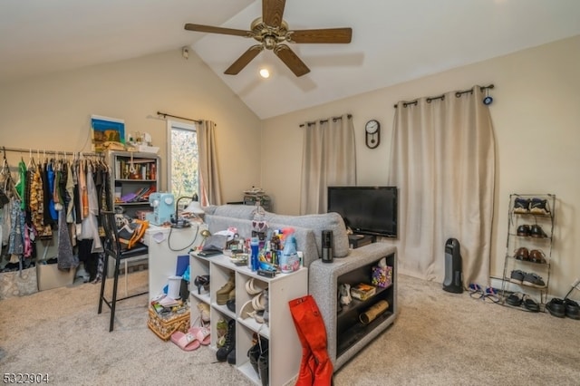 carpeted bedroom with ceiling fan and lofted ceiling