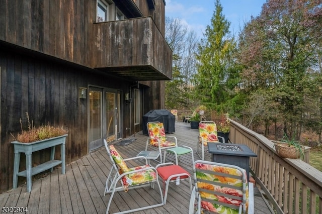 wooden deck with grilling area