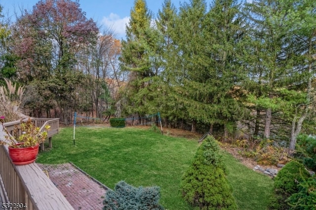 view of yard with a wooden deck