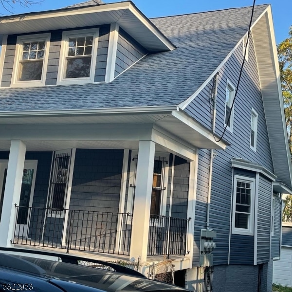 view of property exterior with covered porch