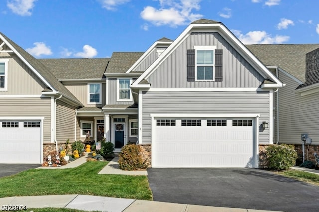 craftsman-style home with a garage