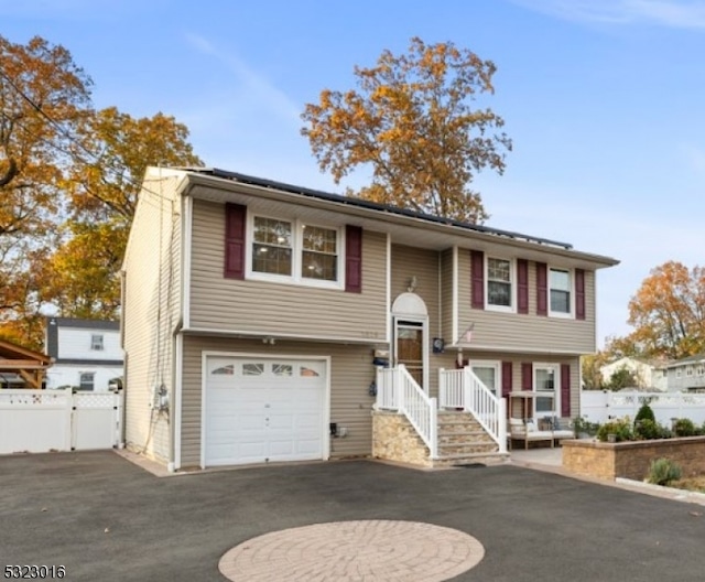 raised ranch featuring a garage