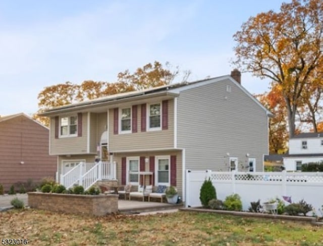 split foyer home featuring a patio