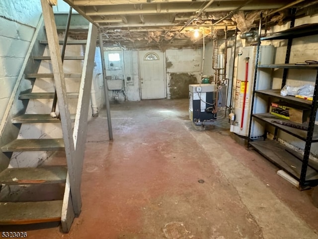 basement with water heater and sink