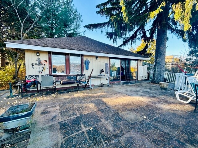 rear view of house featuring a patio area