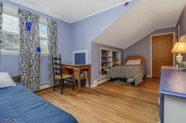 bedroom featuring vaulted ceiling, crown molding, a baseboard heating unit, and wood finished floors