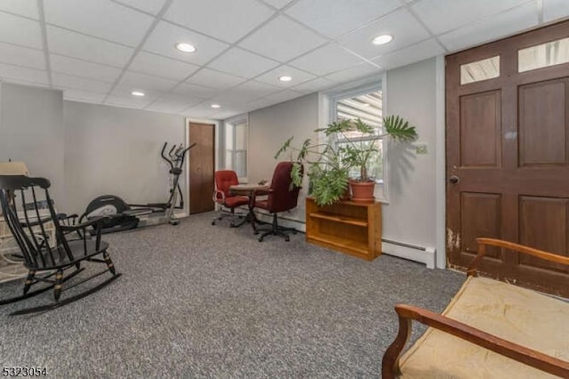 interior space with baseboard heating, recessed lighting, carpet, and a drop ceiling