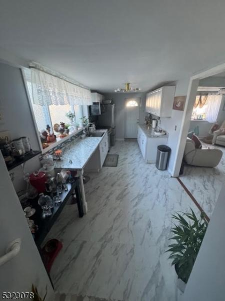 kitchen with white cabinets and sink