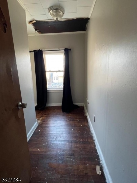 unfurnished room featuring dark hardwood / wood-style flooring