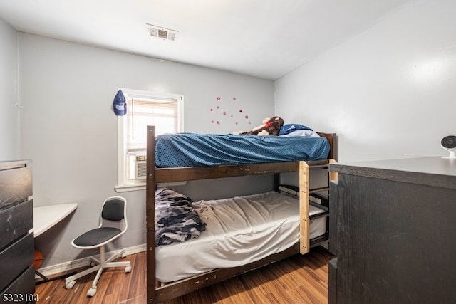 bedroom featuring wood-type flooring