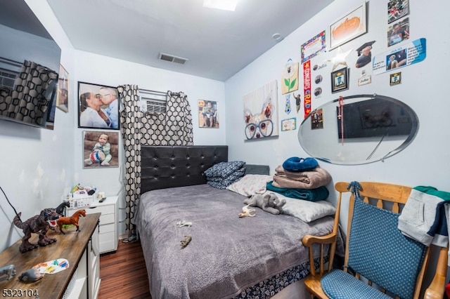 bedroom featuring dark hardwood / wood-style floors