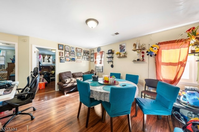 dining area with wood-type flooring