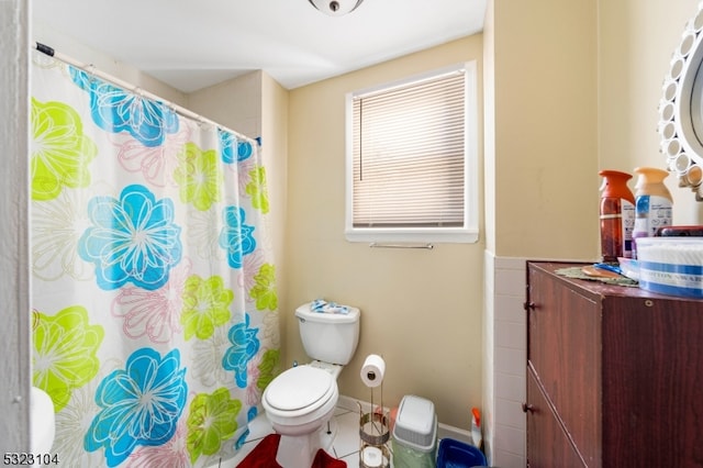 bathroom featuring tile patterned floors and toilet