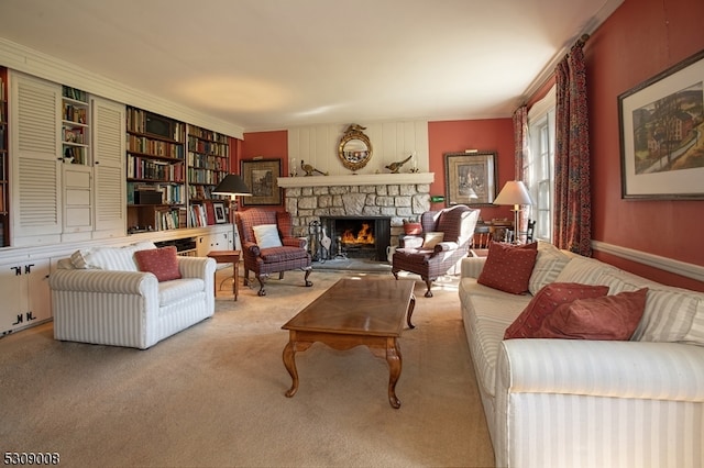 carpeted living room featuring built in shelves, crown molding, and a fireplace