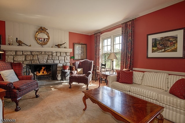 living room featuring a stone fireplace, ornamental molding, and carpet floors