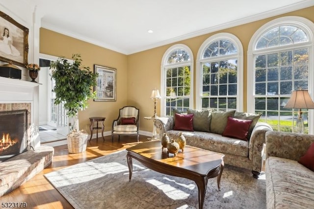 sunroom / solarium with a lit fireplace