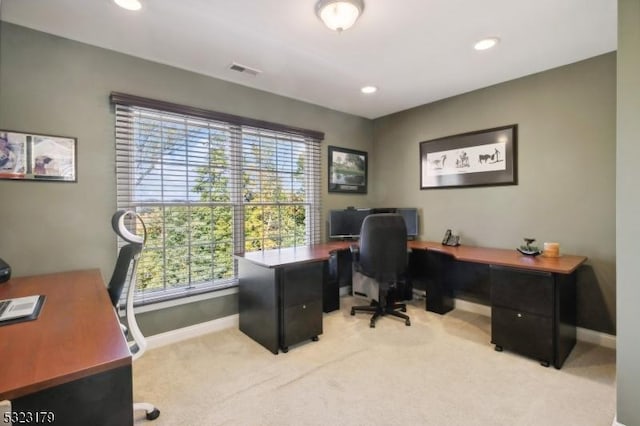 office space with recessed lighting, visible vents, light carpet, and baseboards