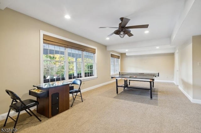 recreation room featuring a ceiling fan, recessed lighting, light colored carpet, and baseboards