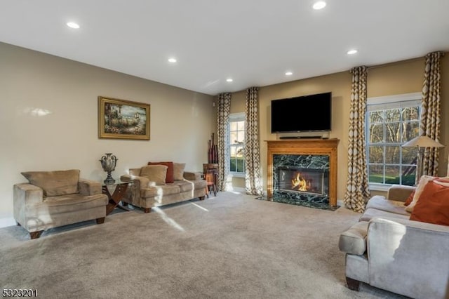 carpeted living room with a fireplace