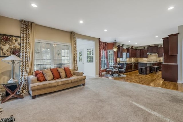 living room featuring light carpet