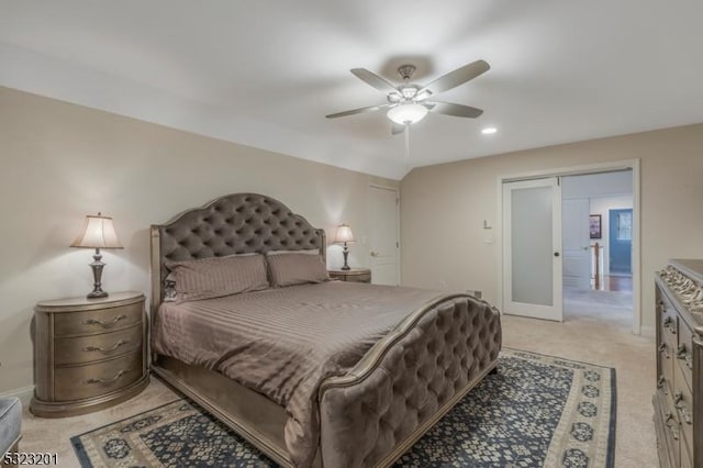 carpeted bedroom featuring lofted ceiling and ceiling fan