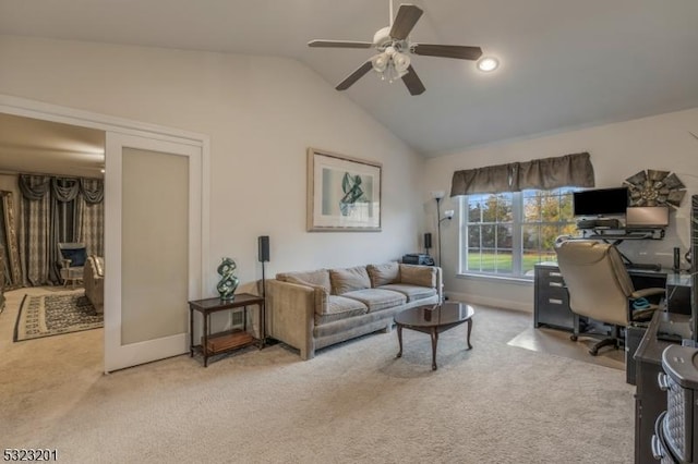 home office with ceiling fan, vaulted ceiling, and light carpet