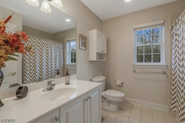 bathroom with vanity, tile patterned floors, and toilet