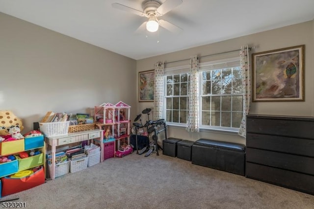 playroom with ceiling fan and carpet floors