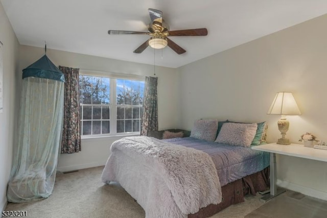 bedroom with light colored carpet and ceiling fan