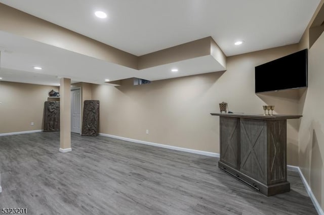 basement featuring hardwood / wood-style floors