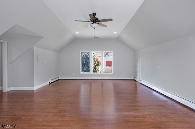 bonus room with dark hardwood / wood-style floors, a baseboard radiator, and lofted ceiling