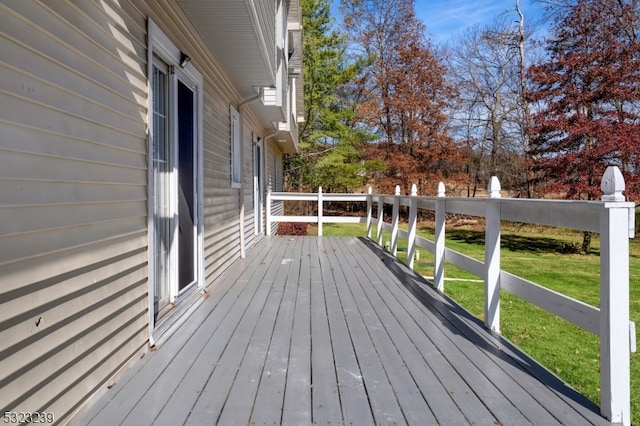 wooden deck with a yard