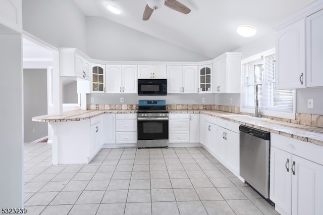 kitchen featuring ceiling fan, white cabinetry, light tile patterned floors, and appliances with stainless steel finishes