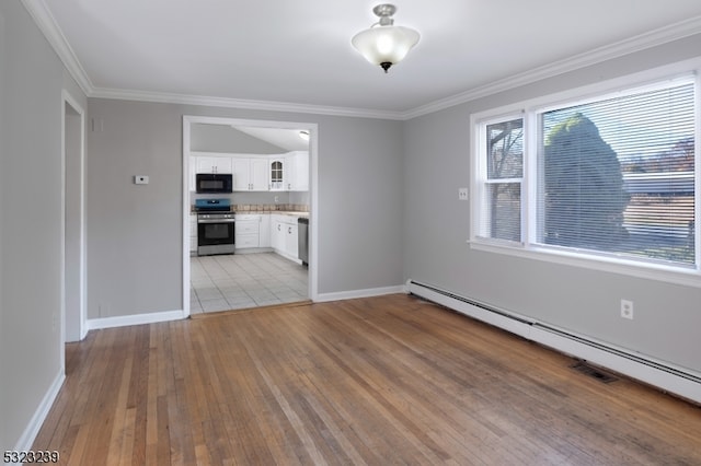 unfurnished living room featuring crown molding, light hardwood / wood-style floors, and a baseboard heating unit