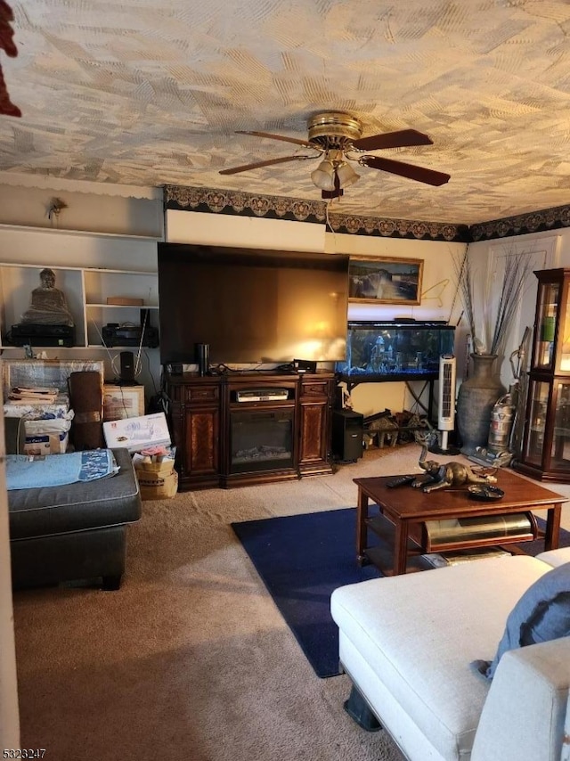 carpeted living room with ceiling fan