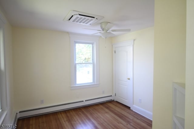 unfurnished room with a baseboard heating unit, light hardwood / wood-style flooring, and ceiling fan