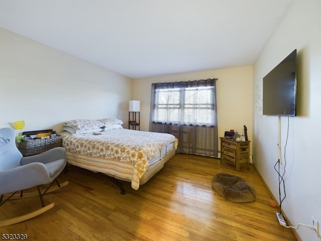 bedroom featuring hardwood / wood-style flooring