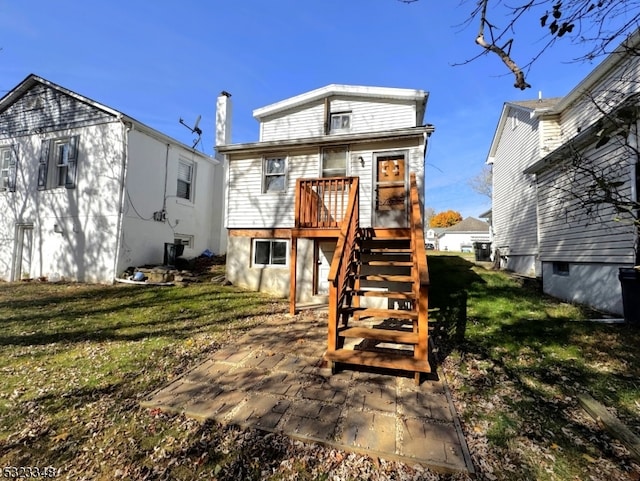 rear view of house with a lawn